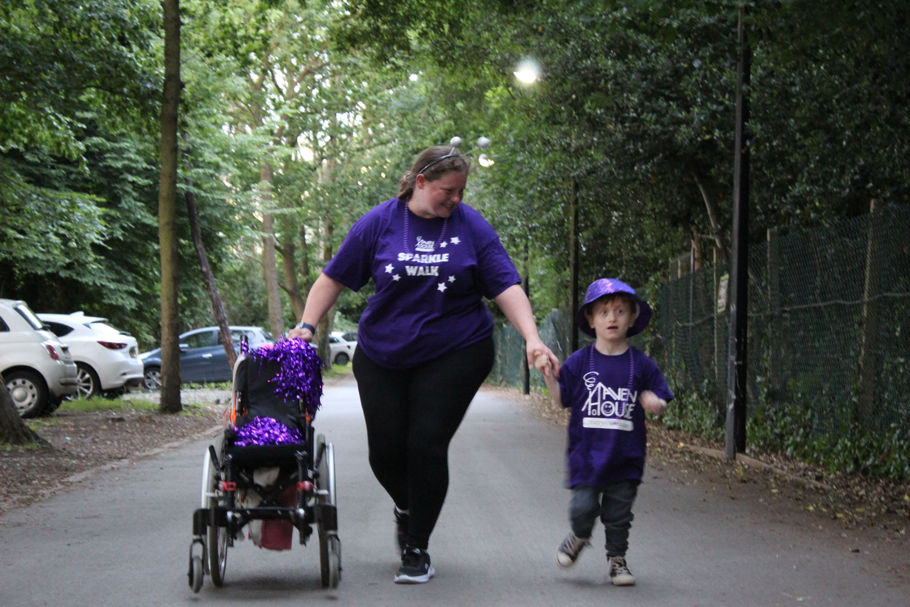 A child and their mum walking